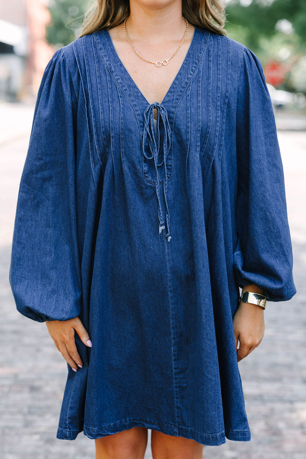 Chic Soul plus size clothing, blue denim long sleeve dress with a v-neckline and a bow detail on the center of the neckline 