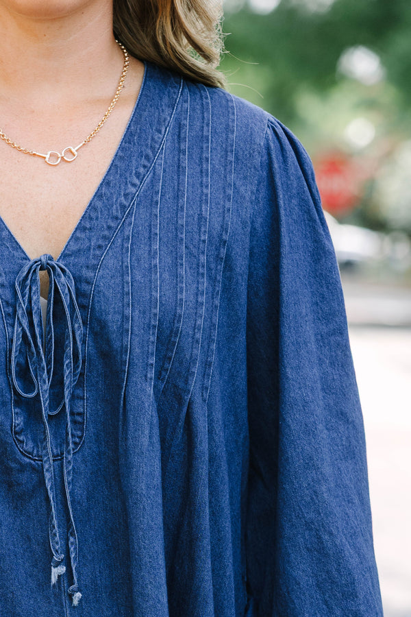 Chic Soul plus size clothing, blue denim long sleeve dress with a v-neckline and a bow detail on the center of the neckline 