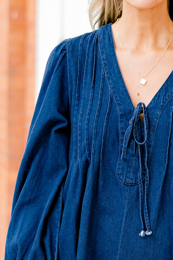 Chic Soul plus size clothing, blue denim long sleeve dress with a v-neckline and a bow detail on the center of the neckline 