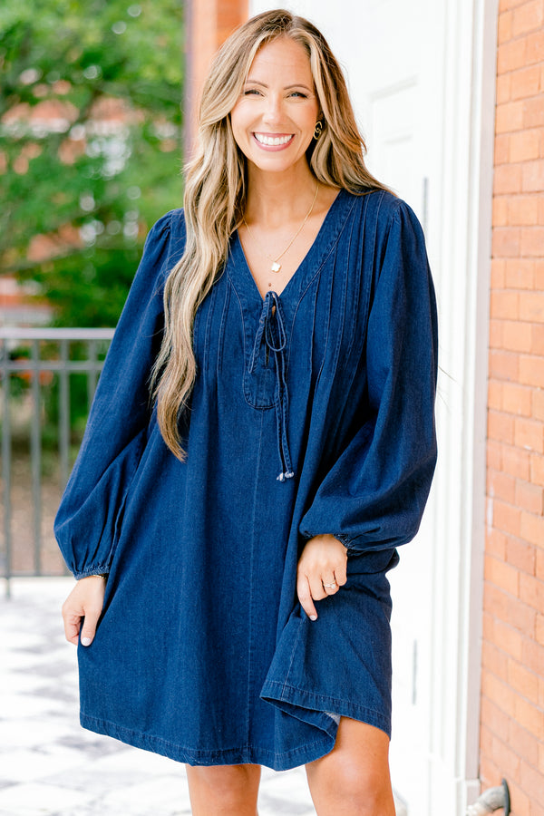 Chic Soul plus size clothing, blue denim long sleeve dress with a v-neckline and a bow detail on the center of the neckline 