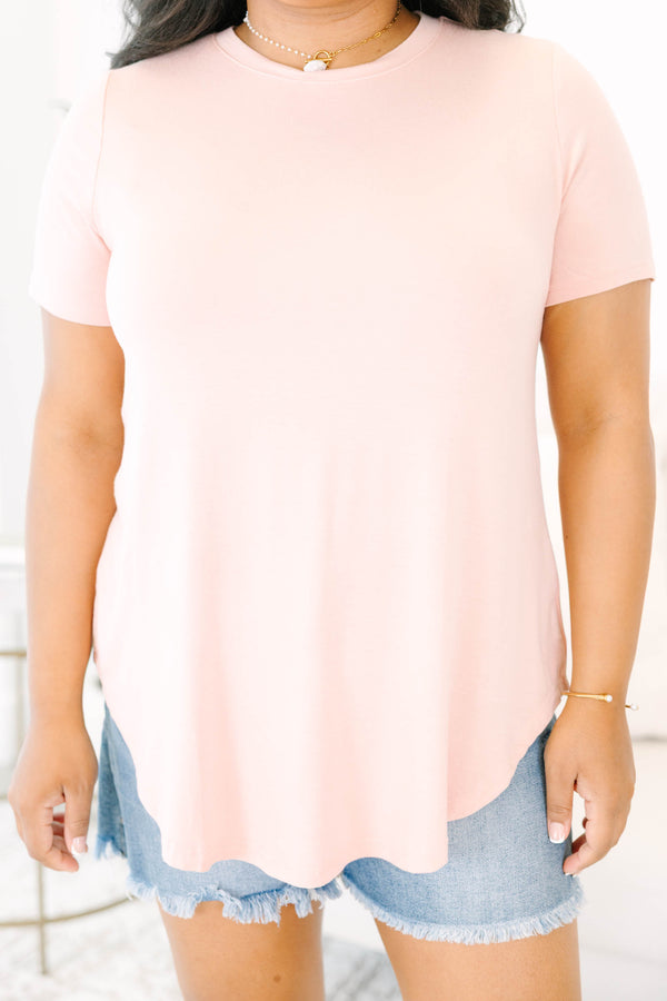 Plus size  dusty rose tunic top with a flowy fit and curved hem