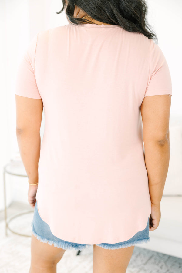 Plus size  dusty rose tunic top with a flowy fit and curved hem