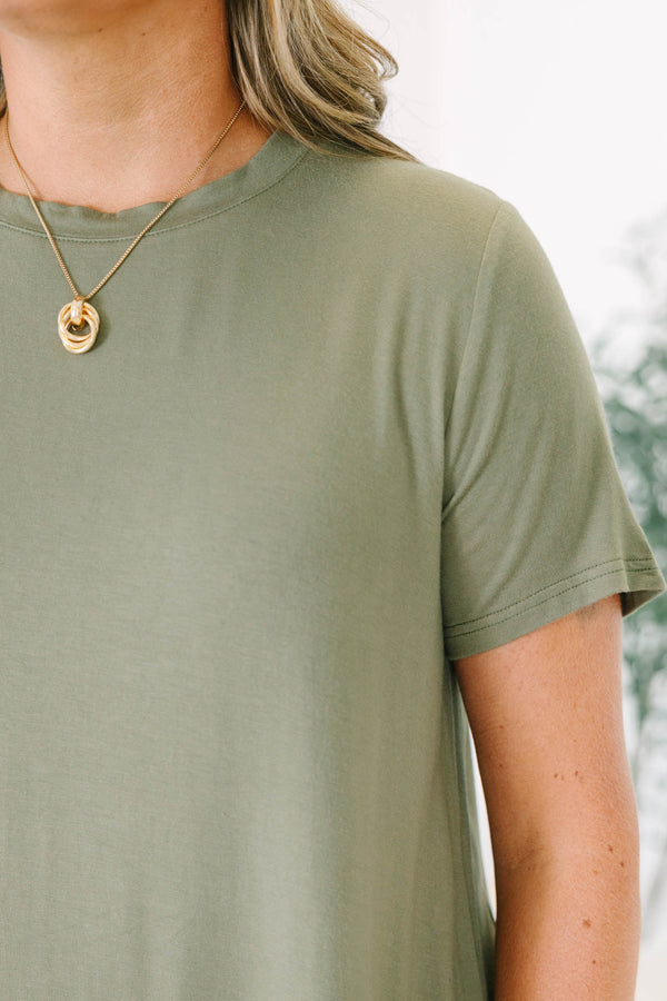Plus size olive green top with a flowy fit and short sleeves.