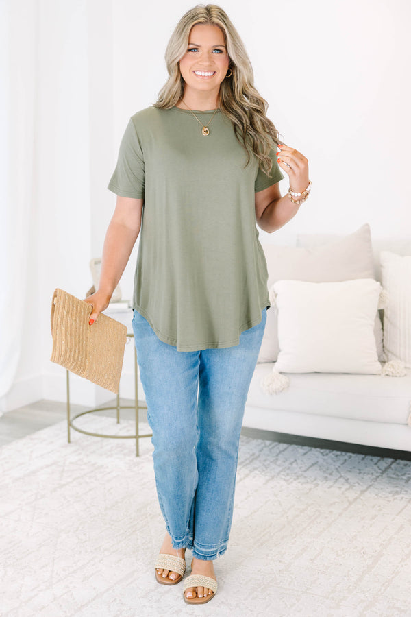 Plus size olive green top with a flowy fit and short sleeves.