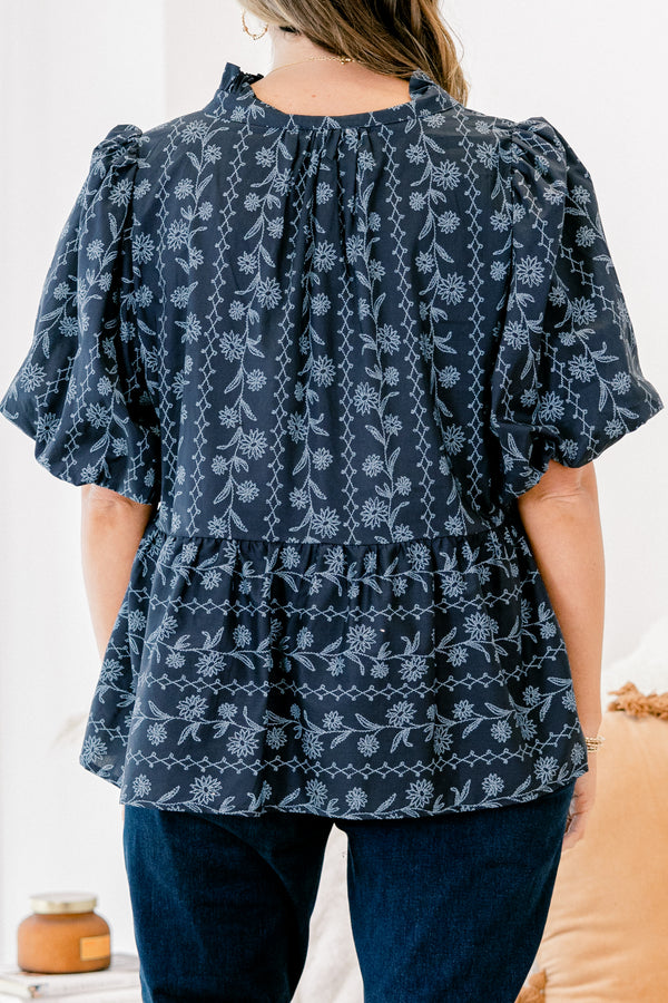 Chic Soul plus size clothing, blue short sleeve top with bubble sleeves and a floral pattern with lace details going down the chest and across the waist 