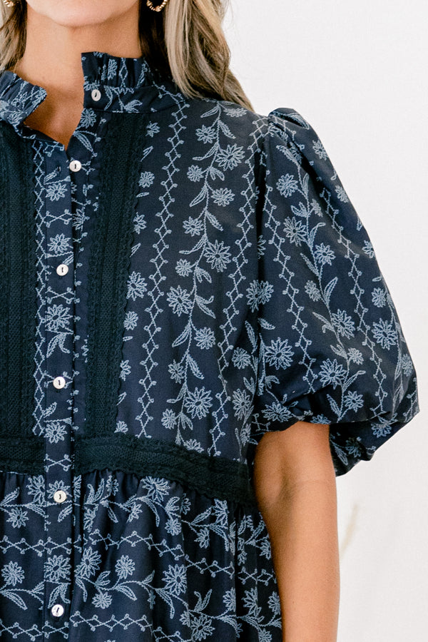 Chic Soul plus size clothing, blue short sleeve top with bubble sleeves and a floral pattern with lace details going down the chest and across the waist 