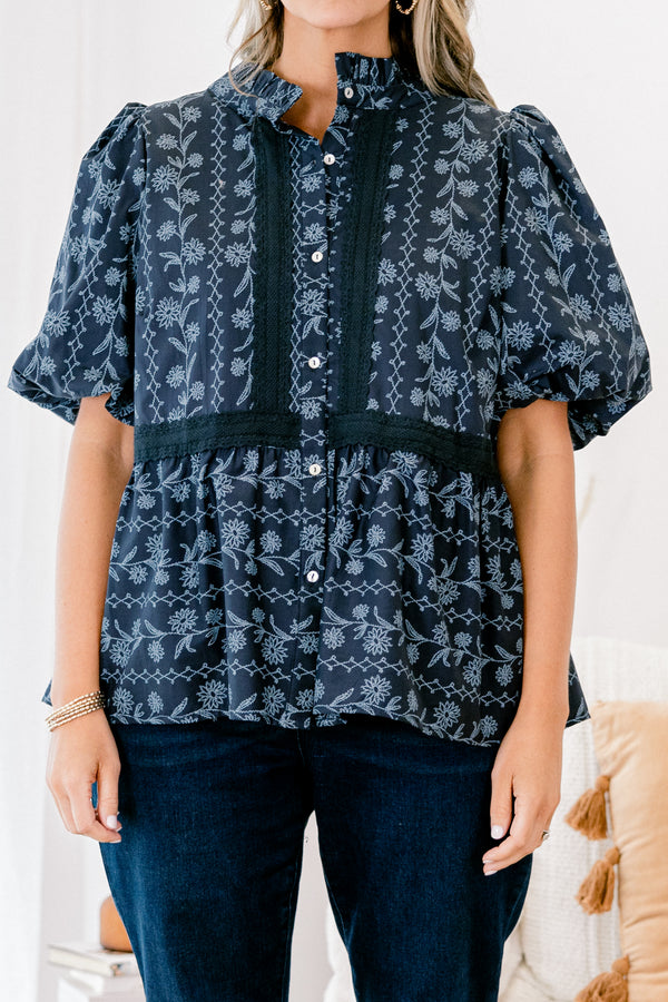 Chic Soul plus size clothing, blue short sleeve top with bubble sleeves and a floral pattern with lace details going down the chest and across the waist 