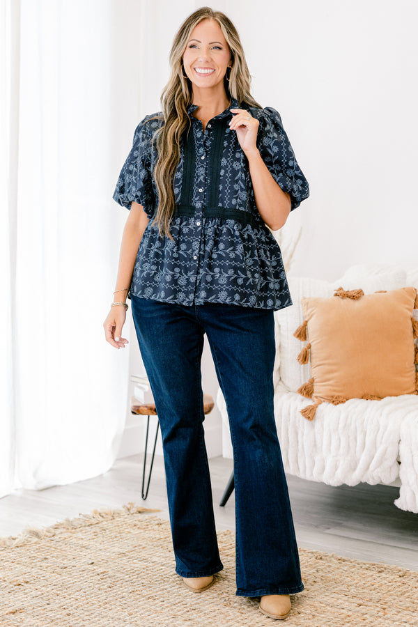 Chic Soul plus size clothing, blue short sleeve top with bubble sleeves and a floral pattern with lace details going down the chest and across the waist 