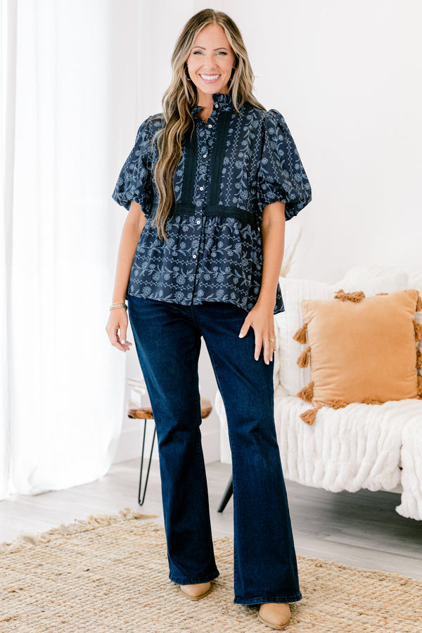 Chic Soul plus size clothing, blue short sleeve top with bubble sleeves and a floral pattern with lace details going down the chest and across the waist 