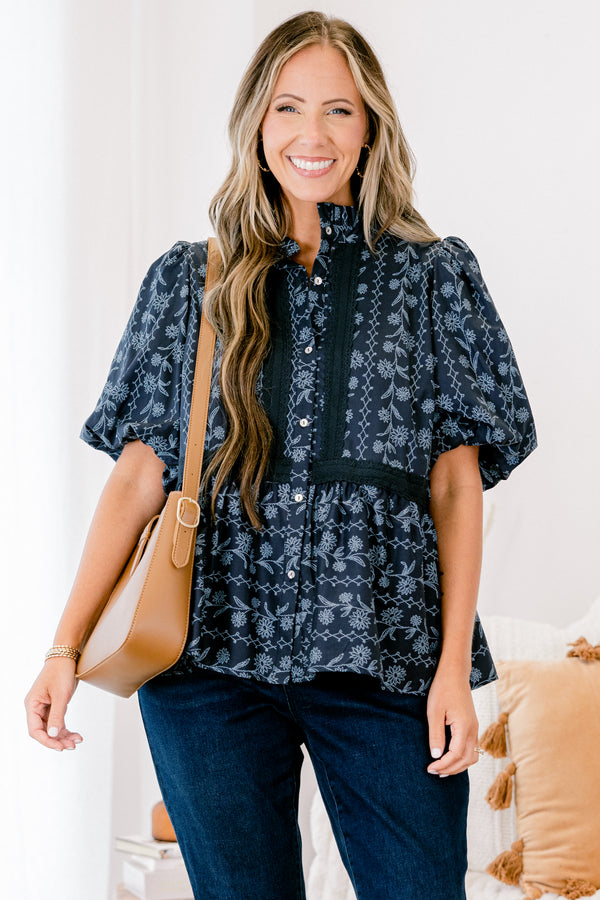 Chic Soul plus size clothing, blue short sleeve top with bubble sleeves and a floral pattern with lace details going down the chest and across the waist 