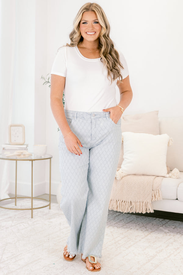 Chic Soul plus size clothing, light blue jeans with a diamond panel pattern throughout front pockets and fringe detailing along the bottom of the jeans 