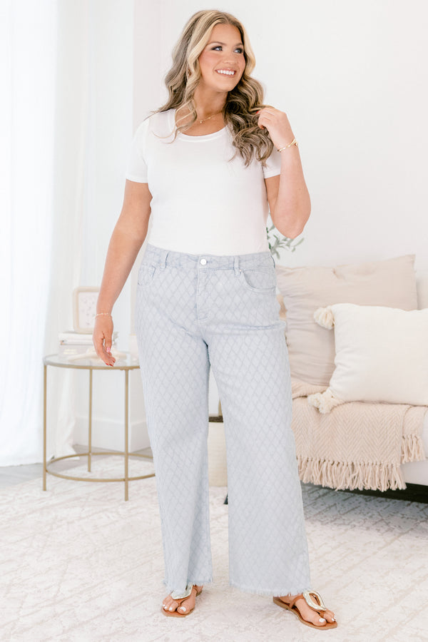 Chic Soul plus size clothing, light blue jeans with a diamond panel pattern throughout front pockets and fringe detailing along the bottom of the jeans 