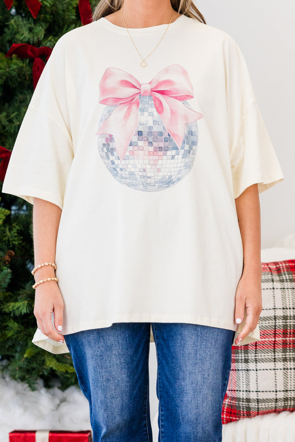 Chic Soul plus size clothing, short-sleeve ivory boyfriend tee with scoop-neckline and graphic art of a disco ball with a pink bow on the top