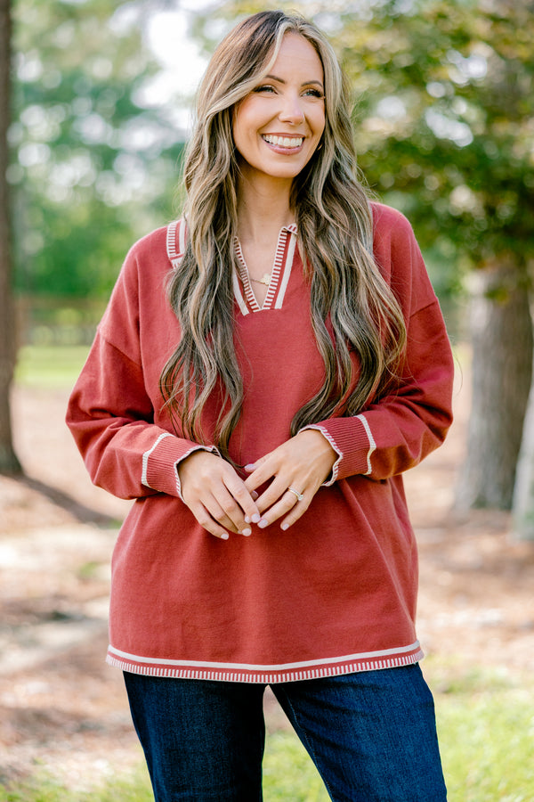 Chic Soul plus size clothing, rust red long sleeve v-neck sweater with collar with white stitching details around the collar, neckline, hem, and sleeves
