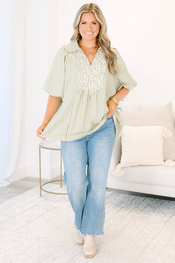 Plus Size olive and white striped top with smocked chest, v-neckline, and short flutter sleeves.
