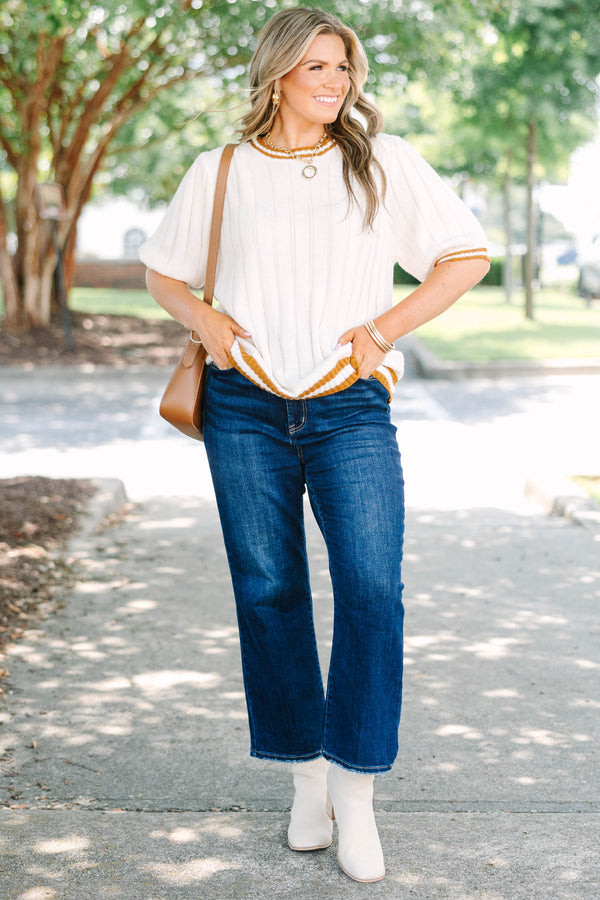 Plus size woman in oatmeal ribbed knit top with mustard stripes