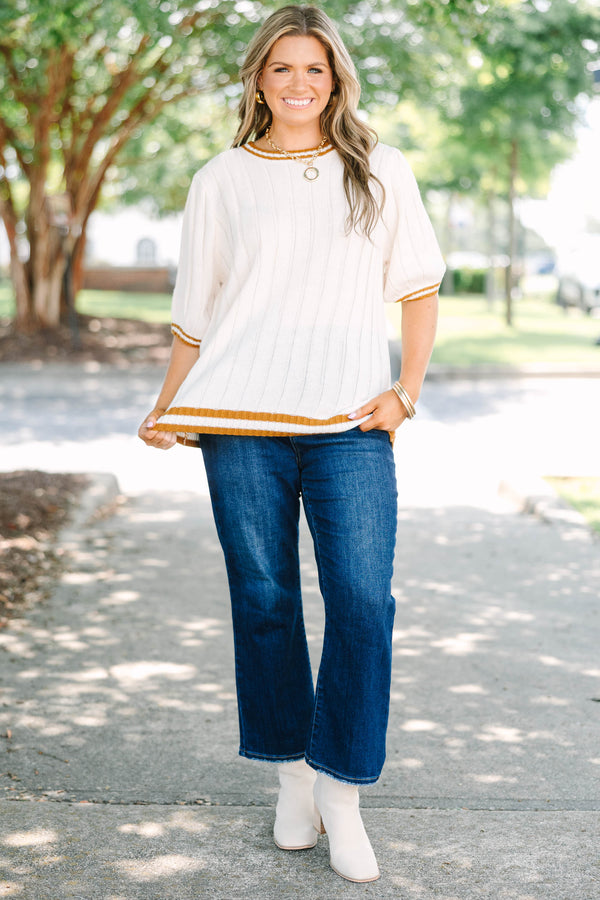Plus size woman in oatmeal ribbed knit top with mustard stripes