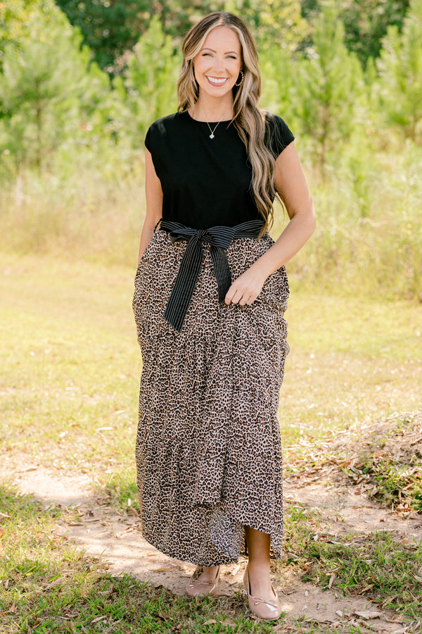 Chic Soul plus size clothing, maxi dress that has a shot sleeve solid black top and a leopard pattern tiered skirt that starts at the waistline as well as a bow that ties around the waist 