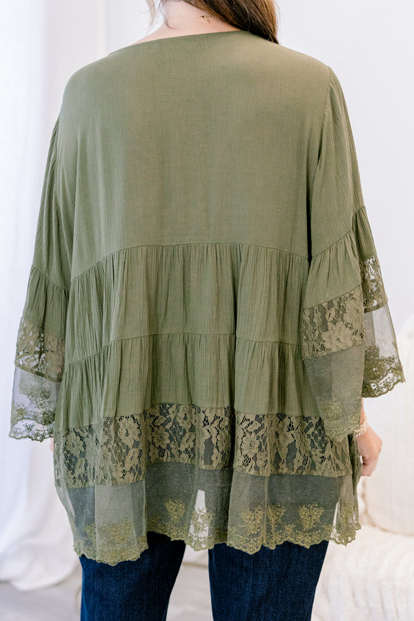 Chic Soul plus size clothing, olive long sleeve blouse with sheer lace details on the bottom of the shirt as well as at the end of each sleeve and buttons going down the middle of the top 