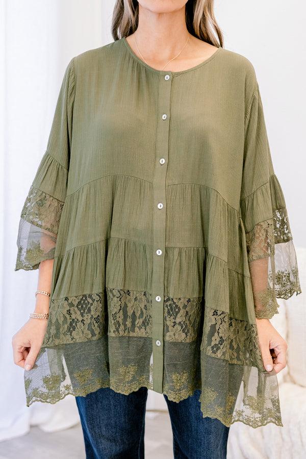 Chic Soul plus size clothing, olive long sleeve blouse with sheer lace details on the bottom of the shirt as well as at the end of each sleeve and buttons going down the middle of the top 