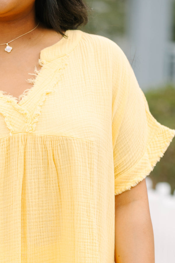 Chic Soul plus size clothing, yellow babydoll style top with frayed hemline