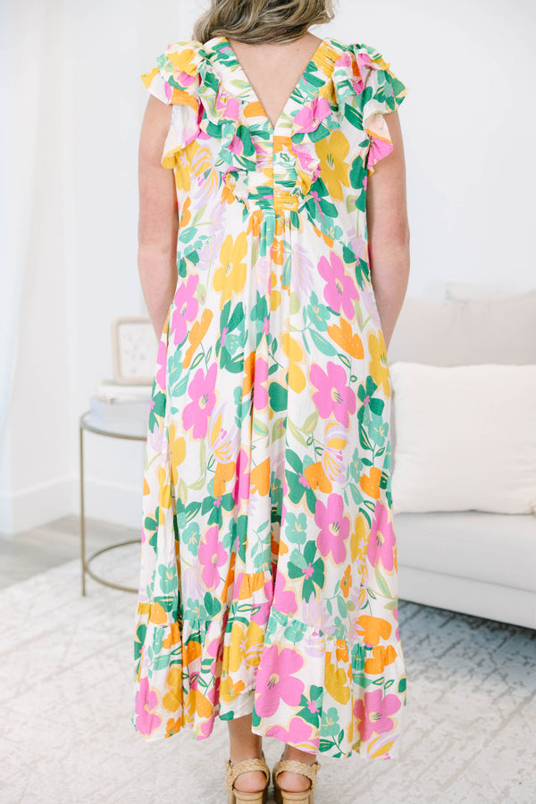 Plus size Dream Vacation Dress in a multi-color floral print with ruffle sleeves and a flowy fit.