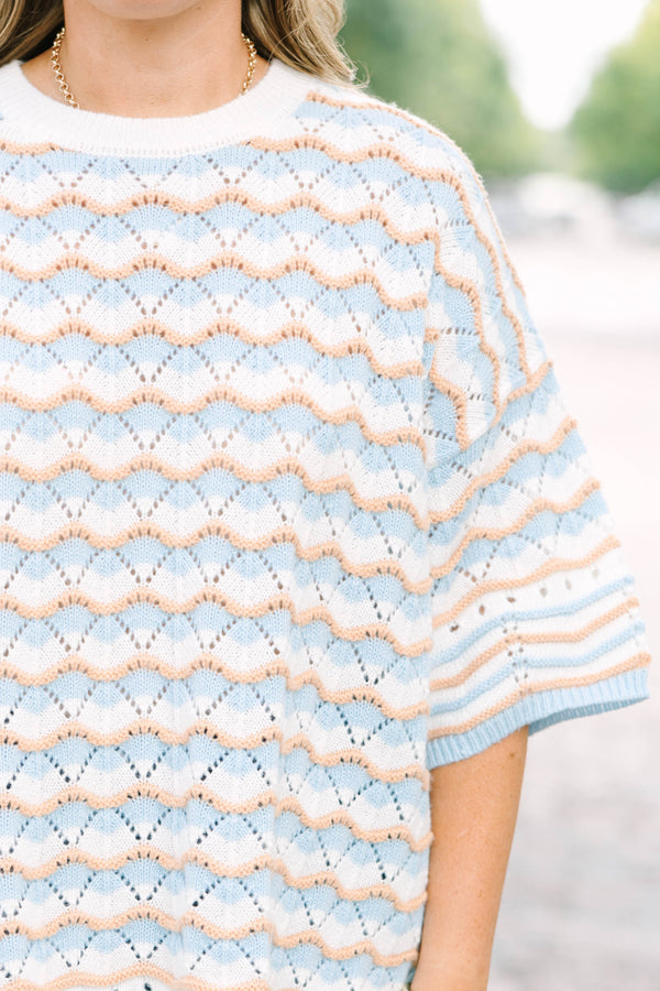 Plus Size blue and tan wavy knit drop shoulder sweater with short sleeves and a crew neckline.