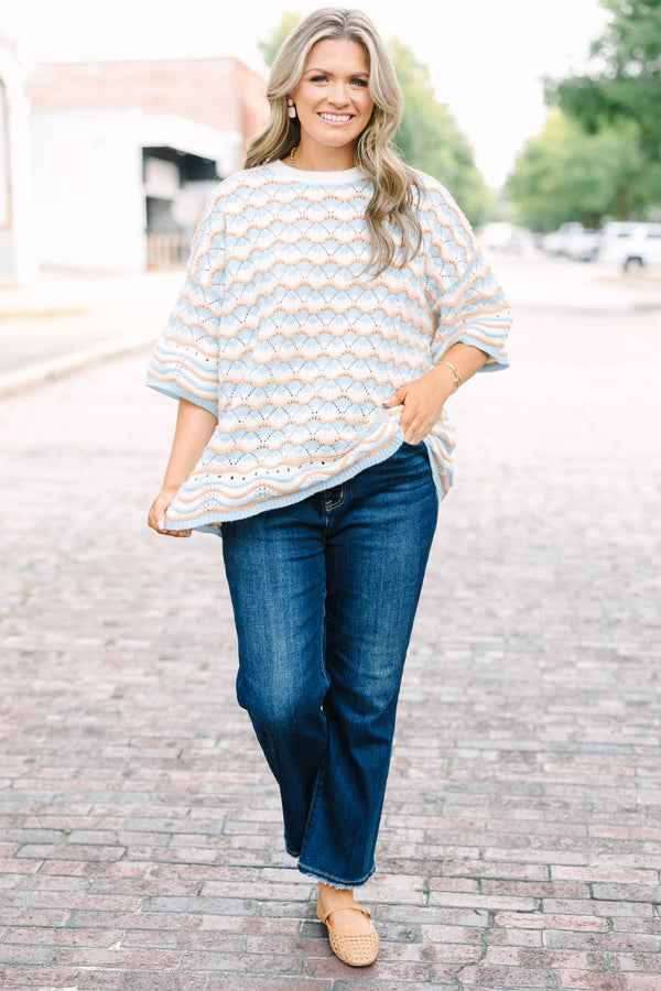 Plus Size blue and tan wavy knit drop shoulder sweater with short sleeves and a crew neckline.