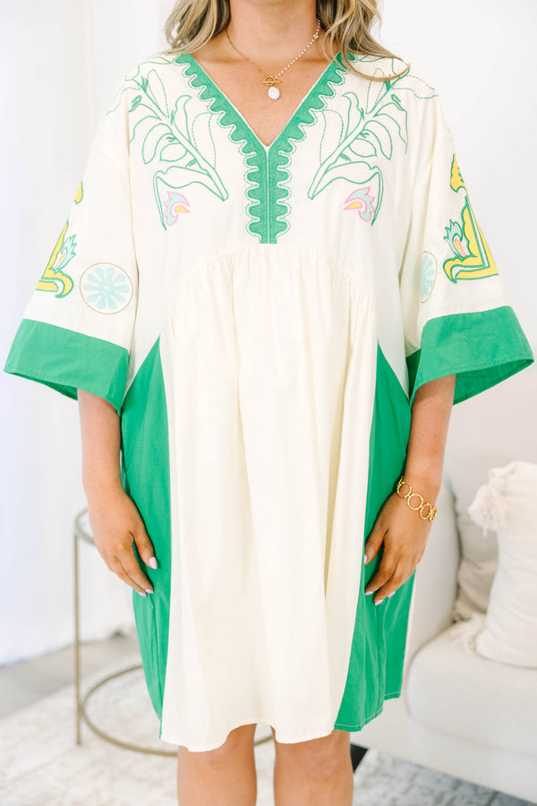 Plus size Dress in green and taupe with boho embroidery and a flowy babydoll fit.
