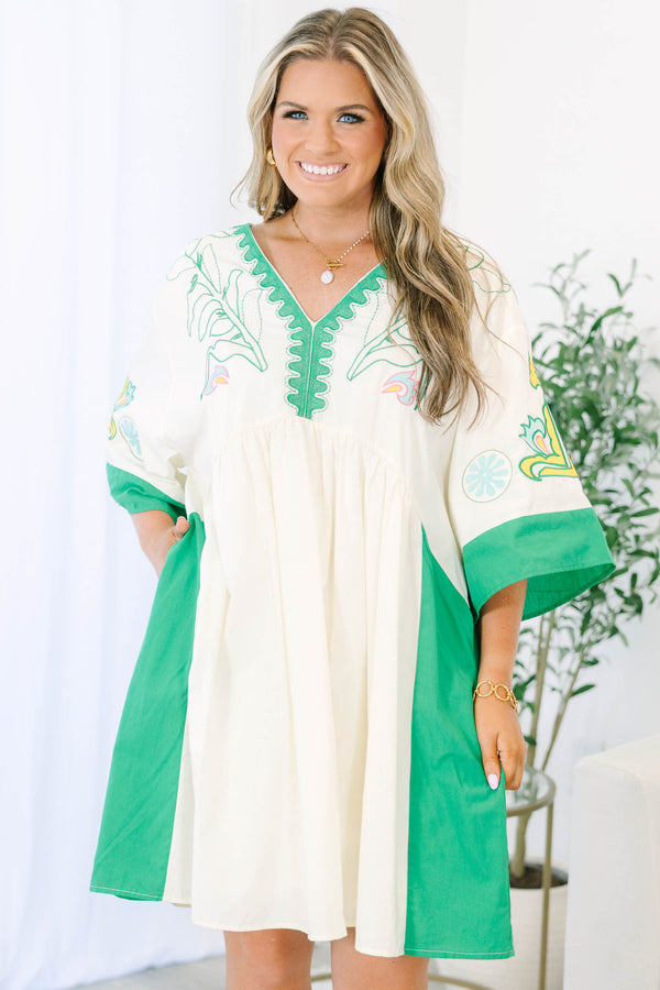 Plus size Dress in green and taupe with boho embroidery and a flowy babydoll fit.