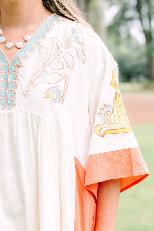 Plus Size cream and orange colorblock midi dress with embroidered V-neckline and wide sleeves.