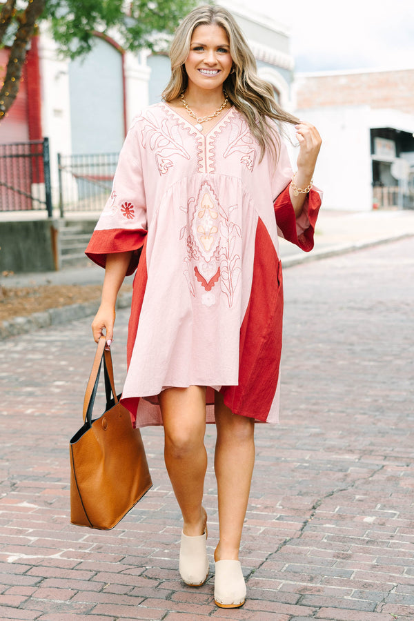 Plus Size pink blush and rust colorblock babydoll dress with intricate embroidery and wide sleeves.
