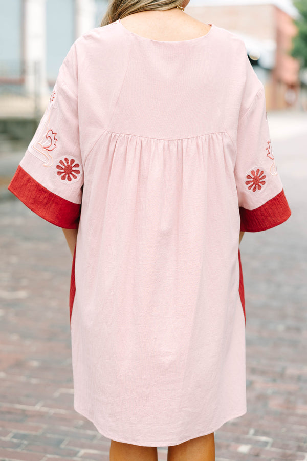 Plus Size pink blush and rust colorblock babydoll dress with intricate embroidery and wide sleeves.