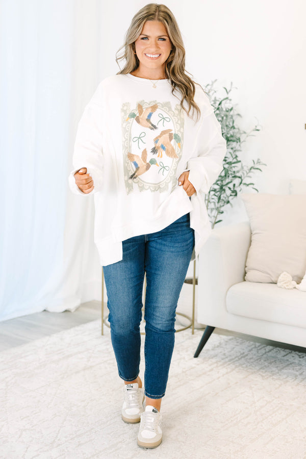Plus size ivory crewneck sweatshirt with a vintage-style duck and bow graphic and a relaxed fit.