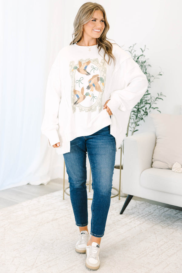 Plus size ivory crewneck sweatshirt with a vintage-style duck and bow graphic and a relaxed fit.
