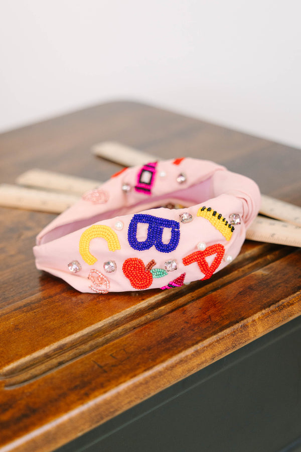 Plus Size pink knotted headband with beaded ABC letters, a red apple, and sparkling gemstones.