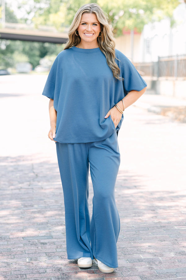 Plus Size dusty blue loungewear set with a short-sleeve curved hem top and matching wide-leg pants.