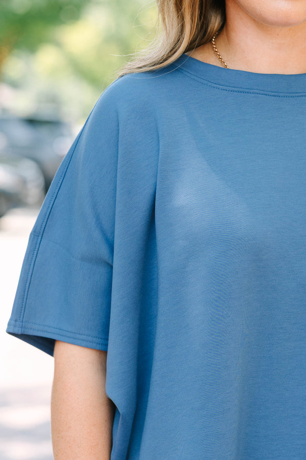 Plus Size dusty blue loungewear set with a short-sleeve curved hem top and matching wide-leg pants.