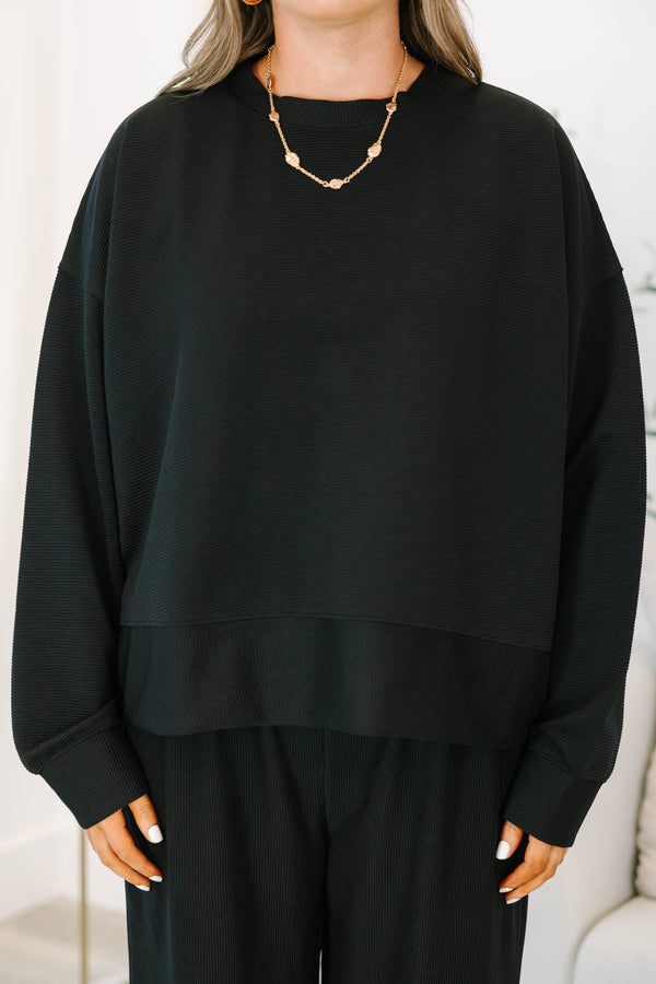Plus Size black ribbed loungewear set featuring a long sleeve crewneck top and wide-leg pants.