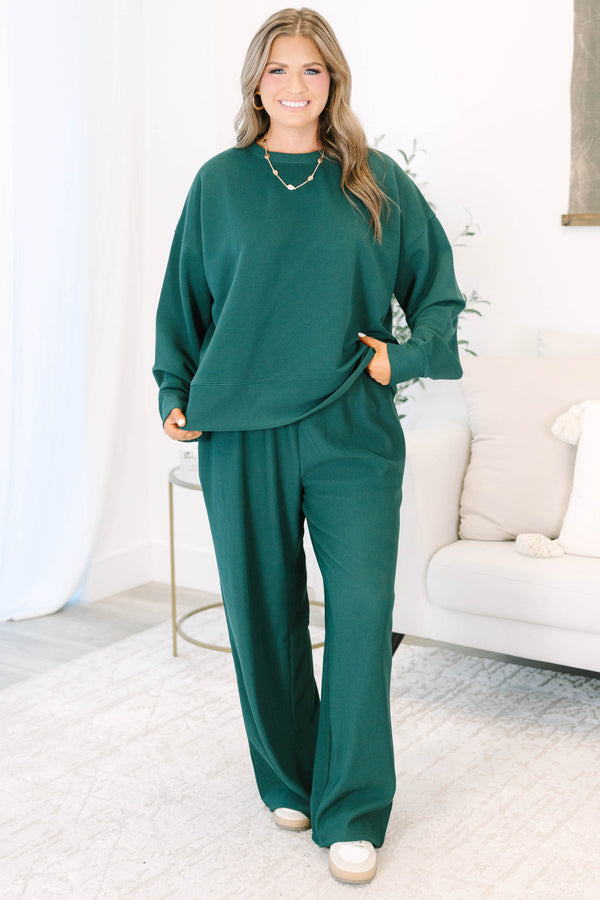 Plus Size hunter green ribbed knit lounge set with a long sleeve crewneck top and wide leg pants.