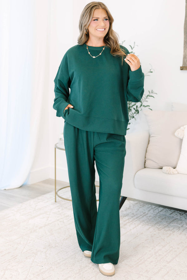 Plus Size hunter green ribbed knit lounge set with a long sleeve crewneck top and wide leg pants.