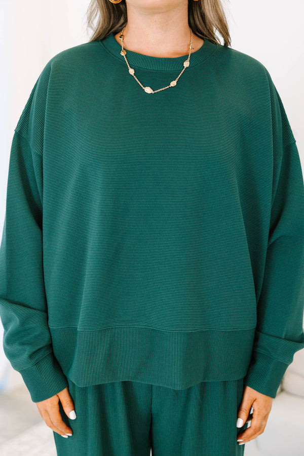 Plus Size hunter green ribbed knit lounge set with a long sleeve crewneck top and wide leg pants.