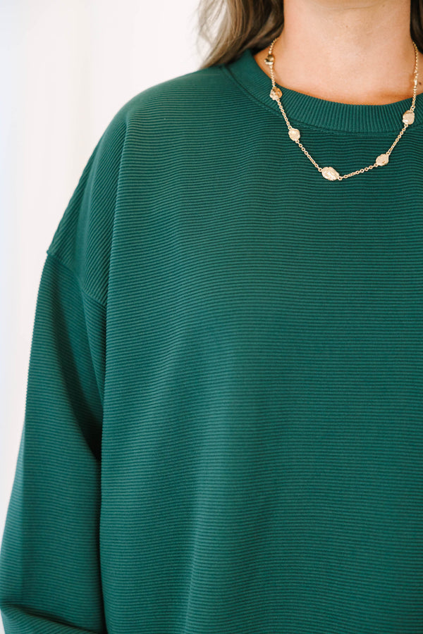 Plus Size hunter green ribbed knit lounge set with a long sleeve crewneck top and wide leg pants.