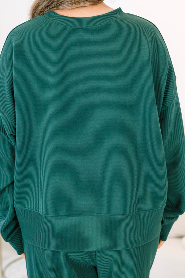 Plus Size hunter green ribbed knit lounge set with a long sleeve crewneck top and wide leg pants.