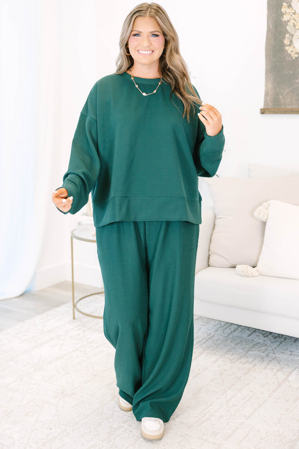 Plus Size hunter green ribbed knit lounge set with a long sleeve crewneck top and wide leg pants.