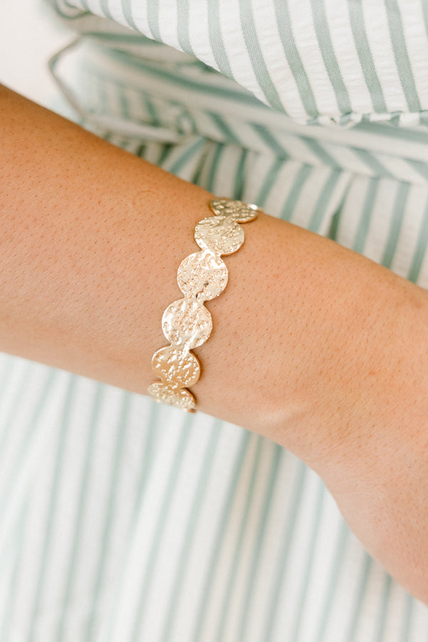 Chic Soul Plus size clothing, Gold bracelet that it made up of textured circle shapes that are connected together to form a bangle 
