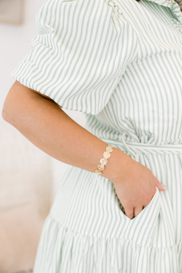 Chic Soul Plus size clothing, Gold bracelet that it made up of textured circle shapes that are connected together to form a bangle 
