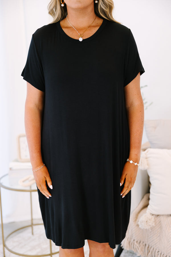 Plus Size short sleeve black crew neck dress with a relaxed fit and side pockets.