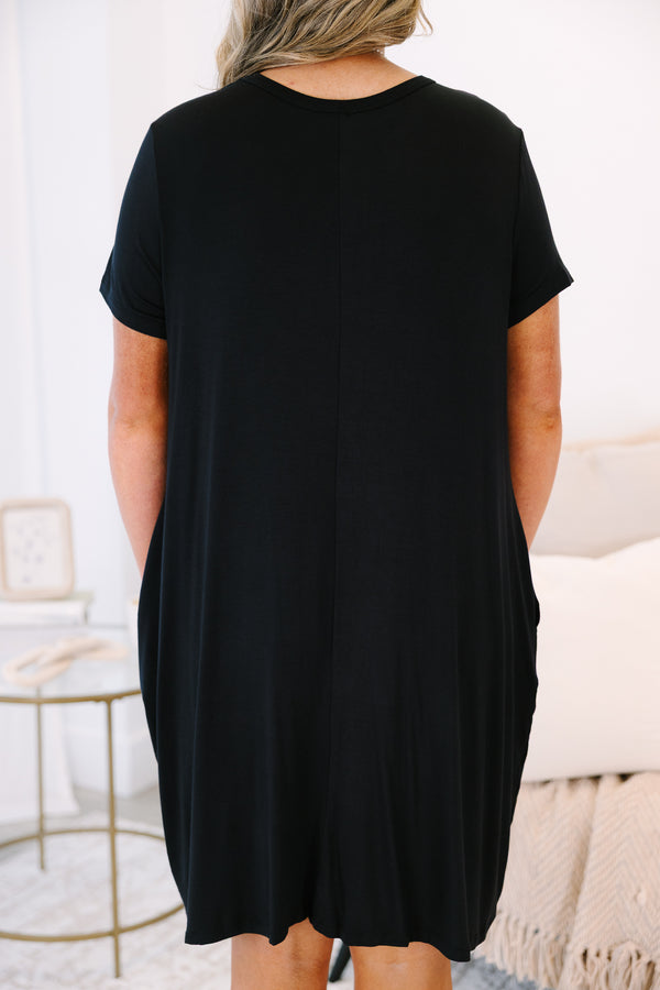Plus Size short sleeve black crew neck dress with a relaxed fit and side pockets.
