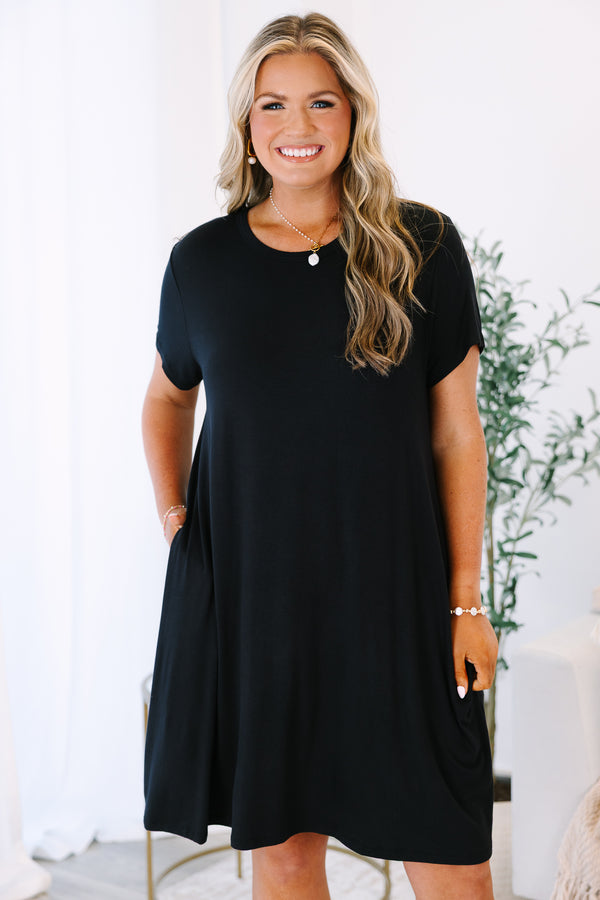 Plus Size short sleeve black crew neck dress with a relaxed fit and side pockets.
